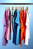 17054366-variety-of-casual-shirts-on-wooden-hangers-on-blue-background